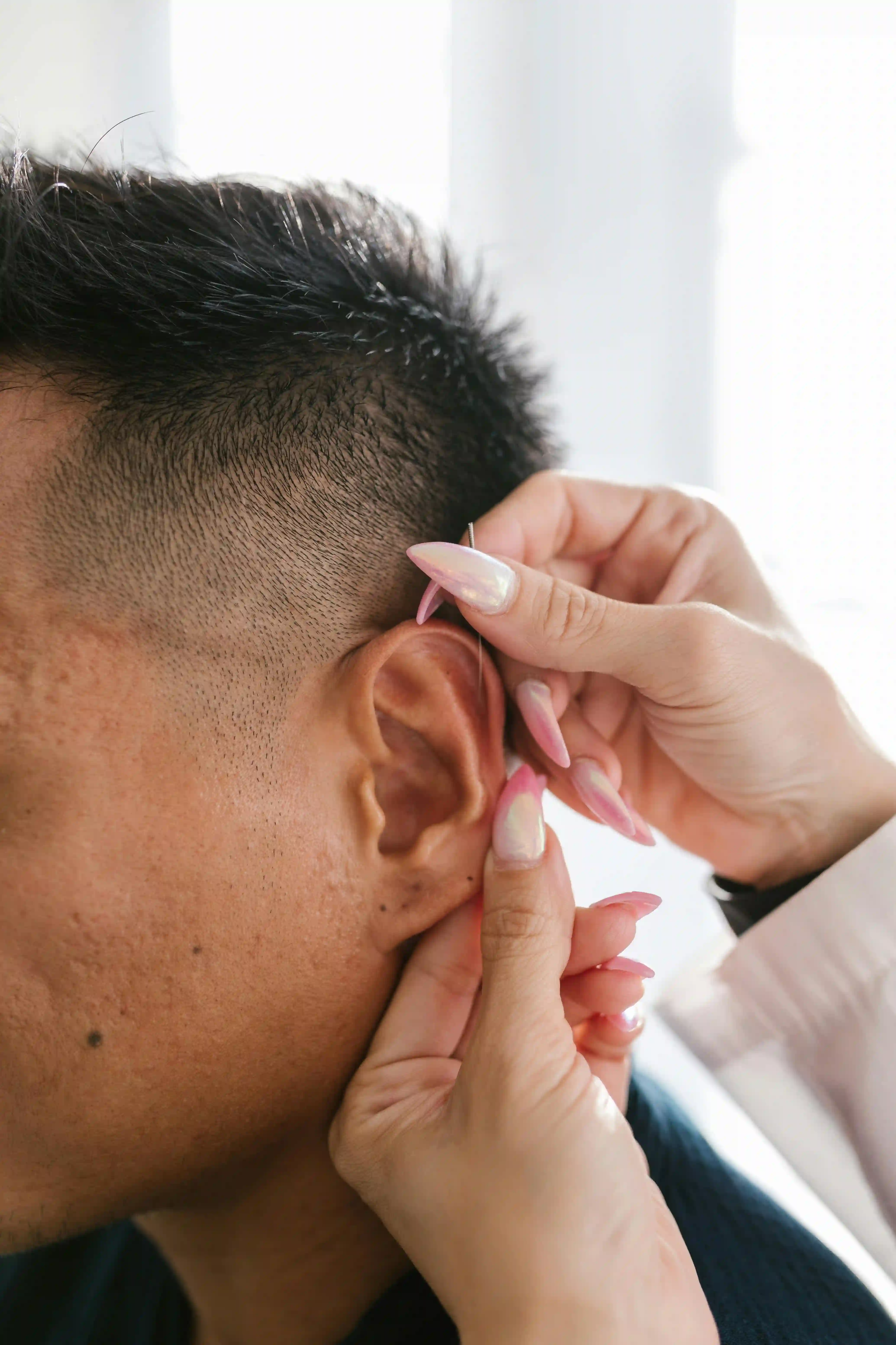 A picture showing a person with an ear infection.