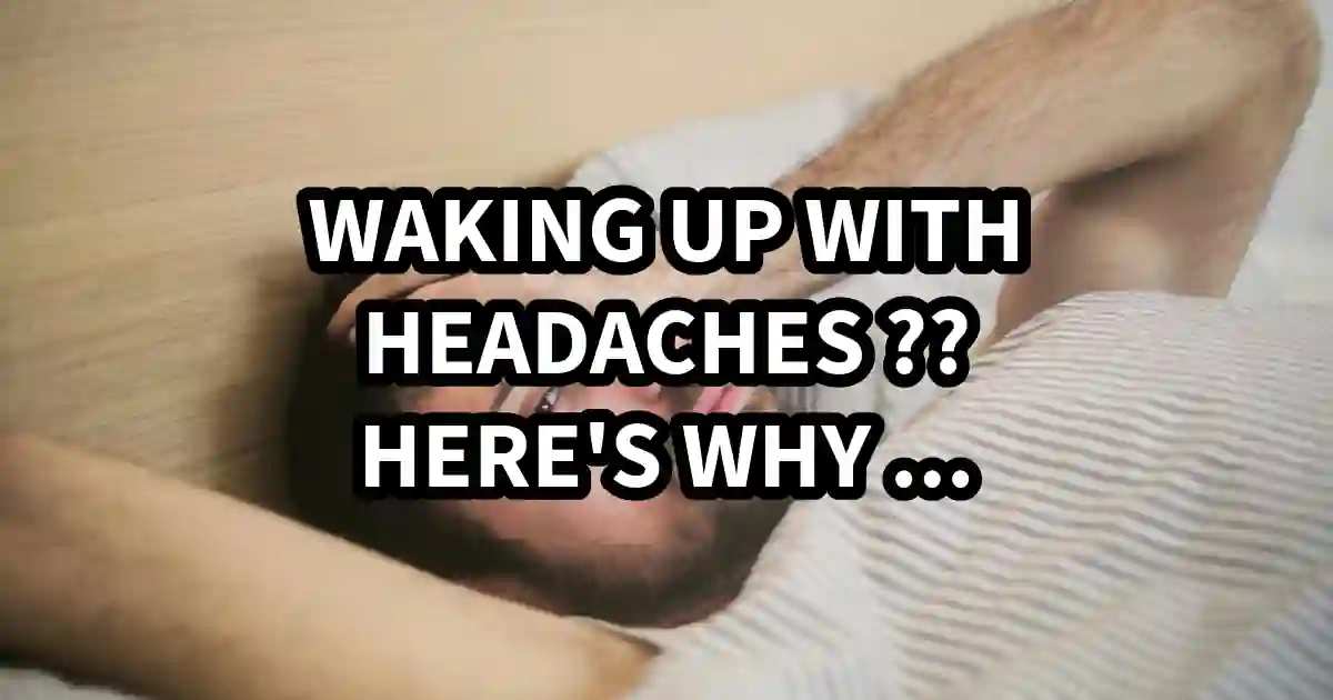 Man waking up holding his head in pain, experiencing a morning headache